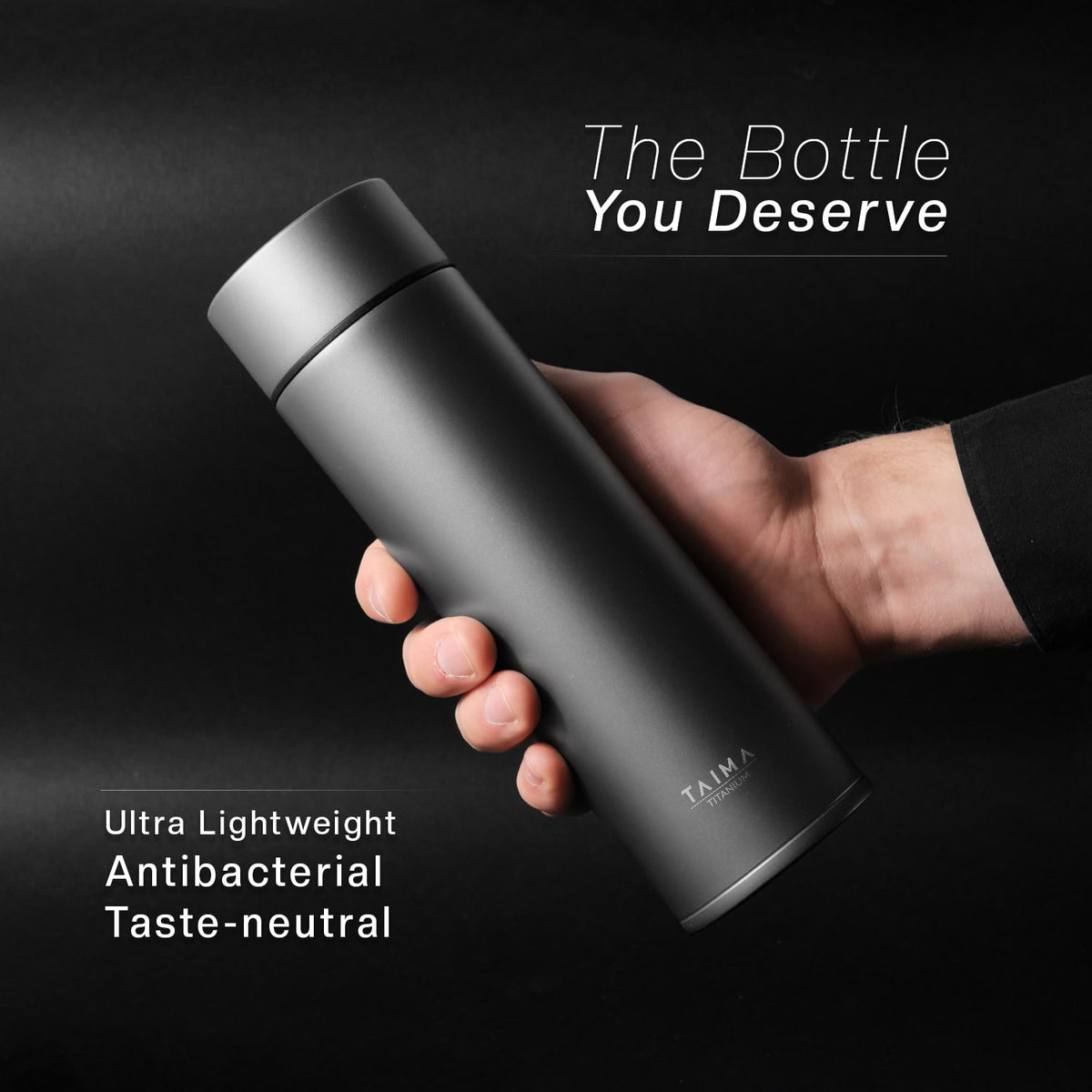 Titanium water bottle held by a hand with promotional text on a dark background