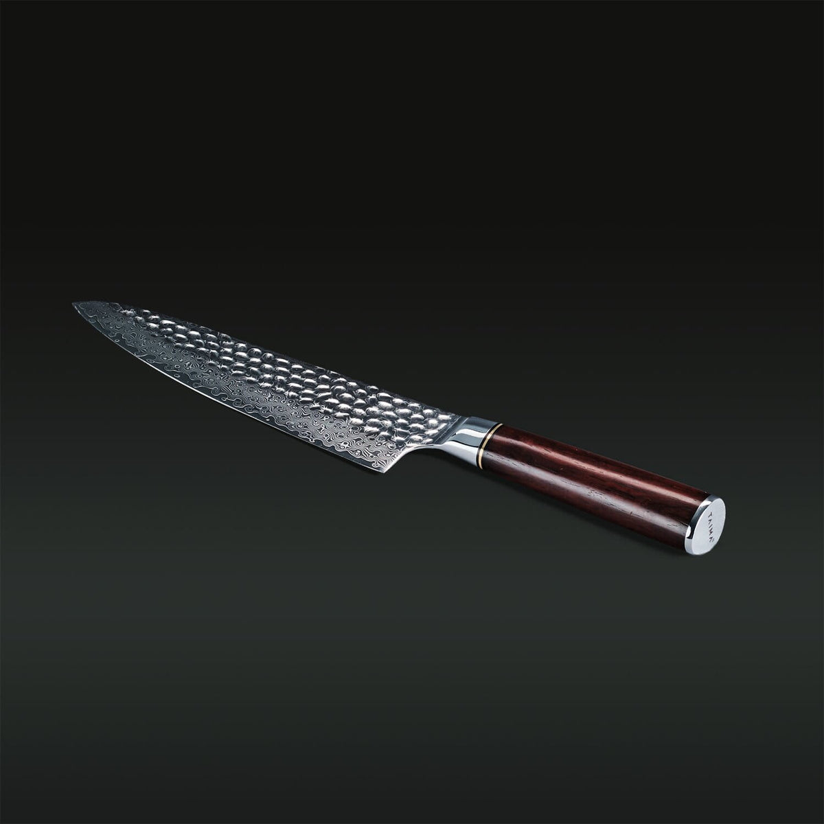 Knife with a textured blade and wooden handle on a dark background