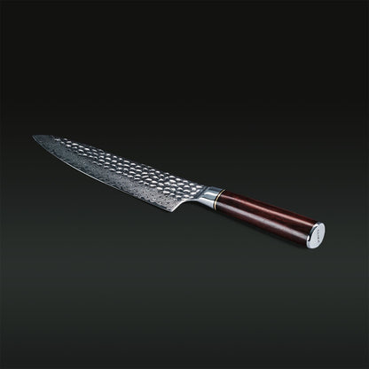 Knife with a textured blade and wooden handle on a dark background