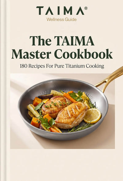 Front cover of The TAIMA Master Cookbook, showing the TAIMA Wellness Guide logo at the top and a photo of cooked chicken with vegetables in a pan on the lower half, all on a warm beige background.