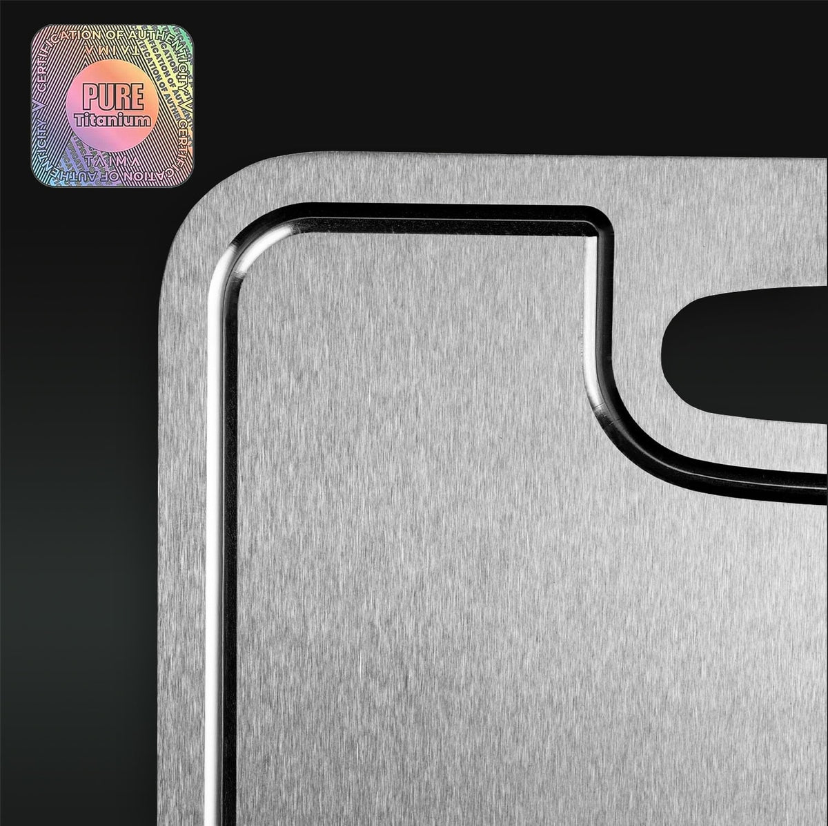 Metallic cutting board with 'Pure Titanium' logo on a black background