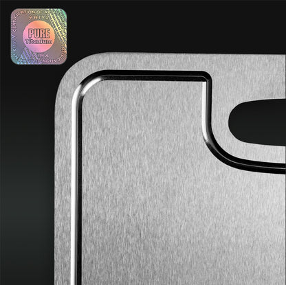 Metallic cutting board with 'Pure Titanium' logo on a black background