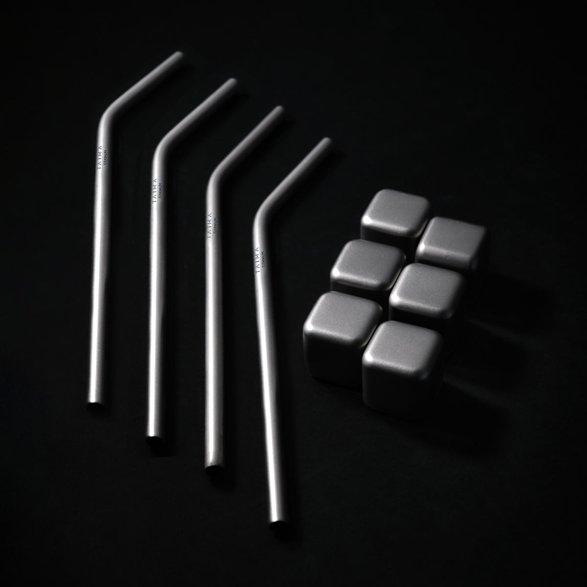Set of metal straws and metal cubes