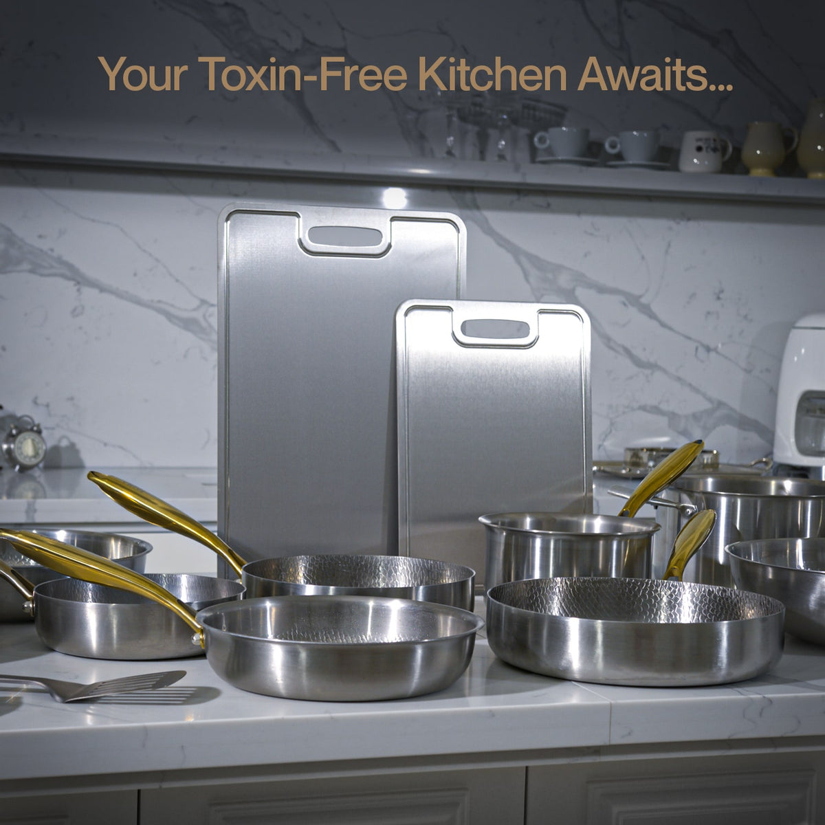 Titanium cookware on a kitchen counter with text 'Your Toxin-Free Kitchen Awaits...'