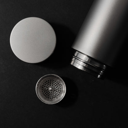 Silver thermos with lid and filter
