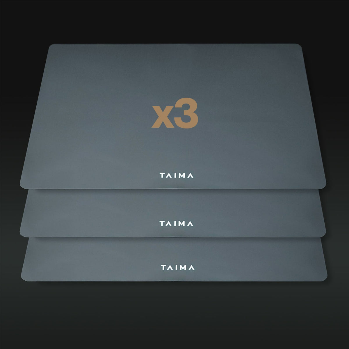 Three gray placemats with 'x3' and 'TAIMA' branding on a dark background